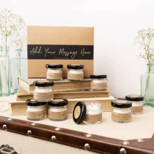 Beeswax luxury candle set, small glass jars, kraft labels, lit wick, gift box.